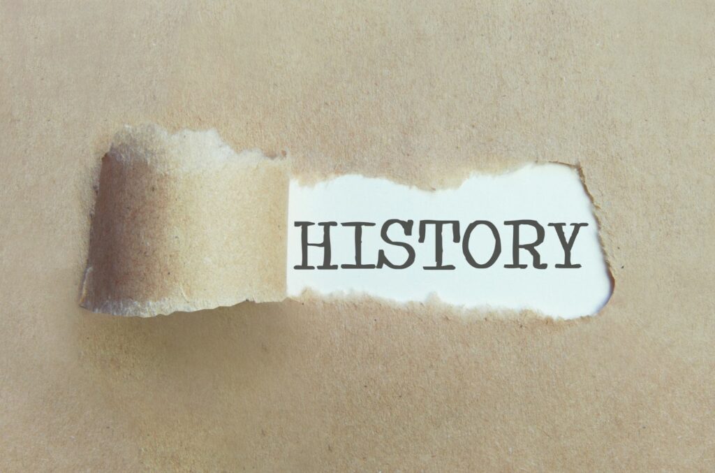 picture of paper peeled back to reveal the word history